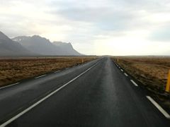 08A Driving on road 54 to the east with Lysuhyrna and Porgeirsfellshyrna mountains in the distance on the south coast of Snaefellsnes Peninsula Iceland