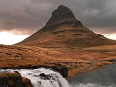 05C Looking across the Kirkjufellfoss lower waterfall to Kirkjufell Church Mountain near Grundarfjordur Snaefellsnes Peninsula Iceland