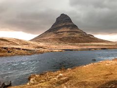 07A Kirkjufell Church Mountain across the stream coming down from Kirkjufellfoss waterfalls near Grundarfjordur Snaefellsnes Peninsula Iceland