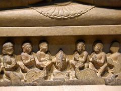 14B Figures At Base Of Preaching Buddha 5C Statue Close Up In Sarnath Archeological Building India