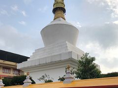 06A Two Monks Walk Past The Prayer Wheels Below Do Drul Chorten In Gangtok Sikkim India