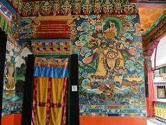 07D Yellow Vaisravana Guardian King of the North Holds A Victory Banner And Mongoose At The Entrance To The Main Temple At Rumtek Gompa Monastery Near Gangtok Sikkim India