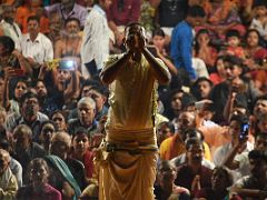 03D A Brahmin Blows A Conch Shell At The Start Of The Ganga Aarti Fire Ceremony On The Banks Of The Ganges Varanasi India