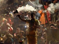 05A A Brahmin Rings A Bell And Waves Lamp Smoke In The Ganga Aarti Fire Ceremony On The Banks Of The Ganges Varanasi India