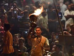 07A A Brahmin Rings A Bell And Waves A Lamp With Flames Shooting Into the Air In The Ganga Aarti Fire Ceremony On The Banks Of The Ganges Varanasi India