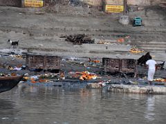 08A A Small Wood Pile Next To A Deserted Burning Ghat From Ganges River Sunrise Tourist Boat In Varanasi India