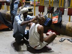 01B Getting An Early Morning Haircut On The Crowded Street Of Varanasi Old Town India