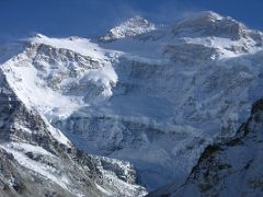 Kangchenjunga 04 04 Kangchenjunga North Face From Pangpema Kangchenjunga's main summit, the third highest in the world at 8586m, and its west summit Yalung Kang to the right, shine in the afternoon sun from Pangpema.…