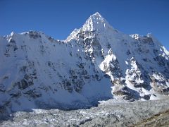 Kangchenjunga 04 08 Wedge Peak From Above Pangpema The aptly named beautiful ice-fluted Wedge Peak (6750m) shines in the early morning sun from above Pangpema. Frank Smythe wrote in The Kangchenjunga Adventure,…