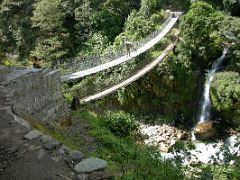 Kangchenjunga 09 06 Bridge between Mamankhe and Pumpe The sun came out early and it was a hot as we trekked from Yamphudin to Sinchewa Bhanjyang. We crossed the new bridge between Mamankhe and Pumpe, with the old…