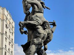 11B Statue of Baatyr Kaba Uulu Kozhomkul Bishkek Kyrgyzstan - his horse became mired in the deep snow so Kozhomkul carried the horse home on his shoulders