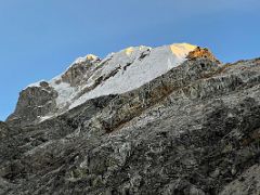 10B The first rays of sunrise on Lobuche Peak from Lobuche East Base Camp 5170m