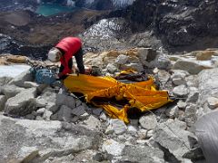 01A Guide Lal Sing Tamang sets up our tent at Lobuche East High Camp 5600m near the end of the rocky ridge