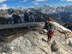 12A Climbing along the Lobuche Peak rocky ridge with views to Lobuche village and Khumbu Glacier below and Makalu, Baruntse, Ama Dablam beyond as we near Lobuche East High Camp 5600m