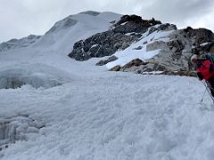 06C Guide Lal Sing Tamang ropes up and leads the way after reaching the snow slopes on the Lobuche East Peak summit climb