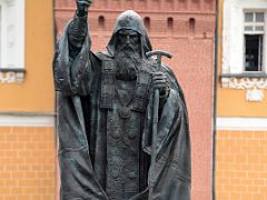 06B Statue of Hermogenes, the Patriarch of Moscow and all Russia from 1606 in Alexander Gardens with the external Kremlin wall beyond Moscow Russia