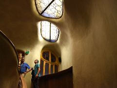 03C Climbing the wooden carved stairs with decorative windows above to the main Noble floor Casa Batllo Gaudi Barcelona Spain