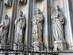 03E Sculpture of the apostles James the Less, Thomas, Philip and John at Porta Santa entrance to the Barcelona Cathedral Spain