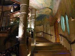 04B The Flower Courtyard stairway with walls and ceiling painted with floral motifs La Pedrera Casa Mila Gaudi Barcelona Spain