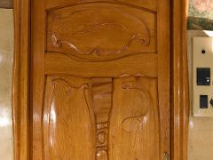 04D Decorative carved wooden door in Flower Courtyard La Pedrera Casa Mila Gaudi Barcelona Spain