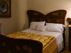 14A The Bedroom features a floral bed frame with winged headboard Tenants Apartment La Pedrera Casa Mila Gaudi Barcelona Spain