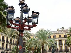 12A The street light in Placa Reial Royal Plaza next to the fountain was designed by Antoni Gaudi in 1879 near La Rambla Barcelona Spain