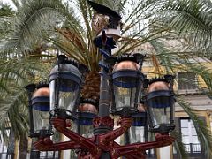 12C The Gaudi street light lamp post in Placa Reial Royal Plaza has six arms and gas lamps on each arm near La Rambla Barcelona Spain