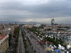 16C View of Barcelona down Passeig de Colom and the sailboats in the harbour from the Columbus monument viewing platform Barcelona Spain