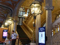 04B The entrance foyer has arches adorned with floral mosaics and stairs to the upper levels Palau de la Musica Catalana Barcelona Spain