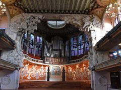 05A The concert auditorium is dominated by the pipe organ over the stage and muses which surround the stage Palau de la Musica Catalana Barcelona Spain