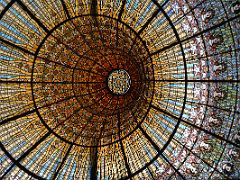 08A Looking up at the huge stained glass drip-shaped skylight which illuminates the concert auditorium Palau de la Musica Catalana Barcelona Spain