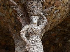 07B Washerwoman stone sculpture in the Portico of the Washerwoman Park Guell Barcelona Spain