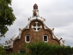 08B Casa del Guarda Porters Lodge has a roof of traditional Catalan clay tiles covered with trencadis, a mosaic made of tile shards Park Guell Barcelona Spain