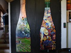 17B We walk upstairs with wine art on the walls at Felix Massana Rafols organic winery in Penedes wine tour Near Barcelona Spain