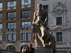 03B Statue of The Blacksmith (El Forjador) by Josep Llimona in 1914 In his right hand he is holding a hammer and in his left hand a chisel in Placa Catalunya Barcelona Spain