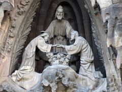 02B The wedding of Joseph and Mary overseen by a high priest Hope portico Nativity facade Sagrada Familia Barcelona Spain