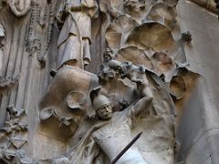 02E Slaughter of the Innocents - Mother defends her child from a Roman Soldier with two dead children at his feet Hope portico Nativity facade Sagrada Familia Barcelona Spain