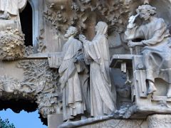 03E Jesus as a young carpenter at his work table with Mary and Joseph Faith portico Nativity facade Sagrada Familia Barcelona Spain