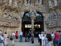 04I The entrance is thru the Charity portico doors Nativity facade Sagrada Familia Barcelona Spain