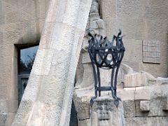 06E Saint Peter has cut off the ear of the High Priests servant and has fallen to the ground holding the sword Passion facade Sagrada Familia Barcelona Spain