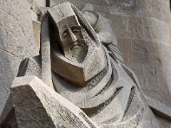 08B Denial of St Peter - Peter is wrapped in a sheet, a symbol of cowardice Passion facade Sagrada Familia Barcelona Spain