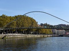 01A Zubizuri Bridge is a tied arch footbridge across the Nervion River Bilbao Spain