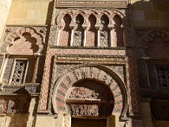 02B Door of Saint Ildephonsus features a lintelled alcove with a blind horseshoe arch and interwoven blind horseshoe arches above Mezquita Mosque Cathedral Cordoba Spain