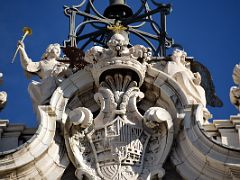 04B Clock And Bell Tower With Statues Of Angels And Royal Coat Of Arms At Royal Palace Madrid Spain