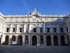 06B Inner Courtyard With Royal Chapel Dome Above And Statues of Roman Emperor Theodosius I and Byzantine Emperor Arcadio After Entering Royal Palace Madrid Spain