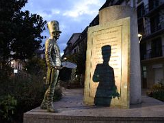 09B Monument to the Drummer looking at a large plaque showing the lyrics of the March of San Sebastian Old Town Parte Vieja San Sebastian Donostia Spain