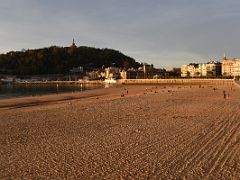 03A The Setting Sun Shines On La Concha Beach With Mount Urgull Above The Old Quarter San Sebastian Donostia Spain