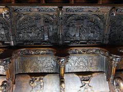 04A The stalls in the lower tier were carved by Rodrigo Aleman in 1495 and feature historical reliefs of scenes from the conquest of Granada Choir Toledo Cathedral Spain