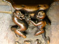 04C Each stall also features a medieval misericord, carved with odd, charming and comical scenes of jokes and everyday life Choir Toledo Cathedral Spain